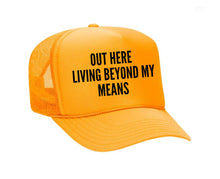 Load image into Gallery viewer, Out Here Living Beyond My Means Trucker Hat
