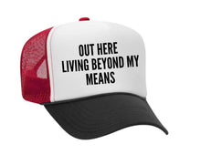 Load image into Gallery viewer, Out Here Living Beyond My Means Trucker Hat
