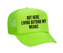 Load image into Gallery viewer, Out Here Living Beyond My Means Trucker Hat
