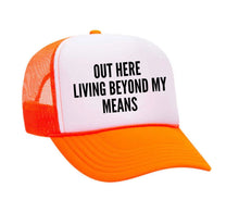 Load image into Gallery viewer, Out Here Living Beyond My Means Trucker Hat
