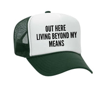 Load image into Gallery viewer, Out Here Living Beyond My Means Trucker Hat
