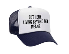Load image into Gallery viewer, Out Here Living Beyond My Means Trucker Hat
