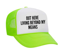 Load image into Gallery viewer, Out Here Living Beyond My Means Trucker Hat
