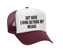 Load image into Gallery viewer, Out Here Living Beyond My Means Trucker Hat

