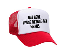 Load image into Gallery viewer, Out Here Living Beyond My Means Trucker Hat
