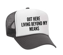 Load image into Gallery viewer, Out Here Living Beyond My Means Trucker Hat
